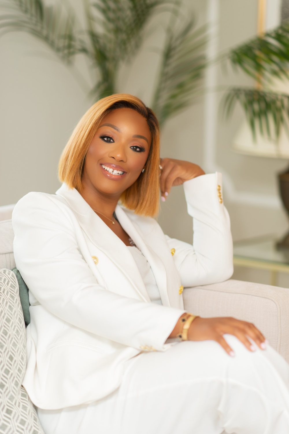 Yema Akinwande, founder of the Business Memory Method, smiling in a white blazer